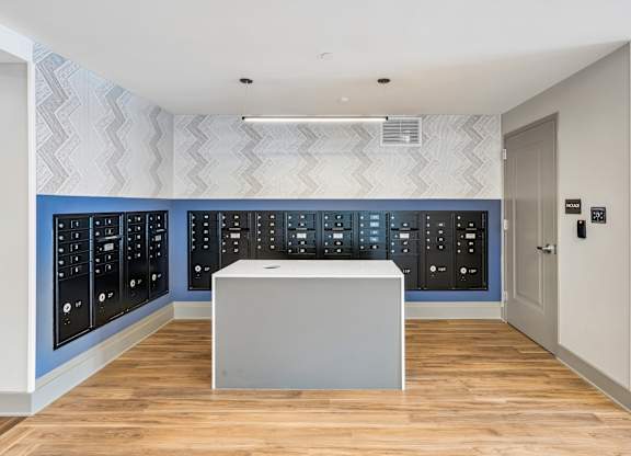 A white box sits in front of a wall of black switches.