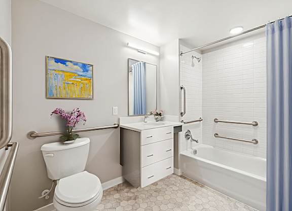 A bathroom with a toilet, sink, and bathtub.