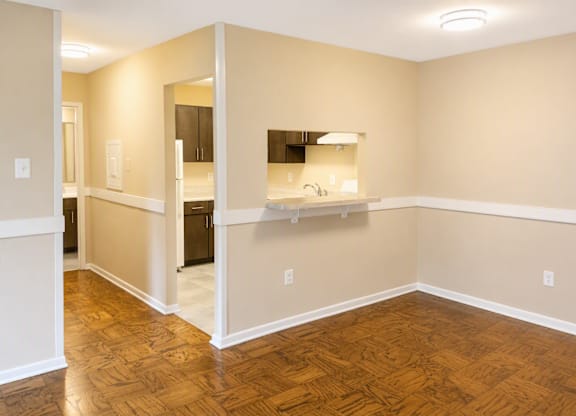 A room with wooden floors and white walls.