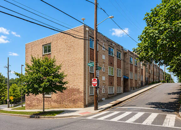 A street view of a residential area with a no entry sign.