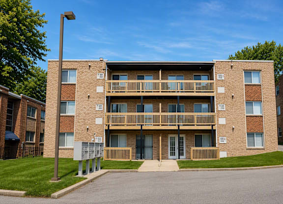 A large brick building with a balcony on the second floor.