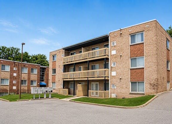 A large brick building with a balcony on the second floor.