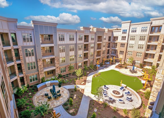 an aerial view of an apartment complex with a playground and fountain at Artesia Big Creek, Alpharetta, GA, 30005
