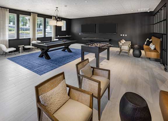 A room with a pool table and a television at Folksong Apartments, Georgia