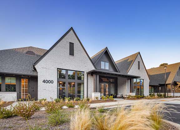 A modern house with a grey facade and a black roof at Folksong Apartments, Georgia