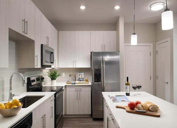 Kitchen with quartz countertops and stainless steel appliances