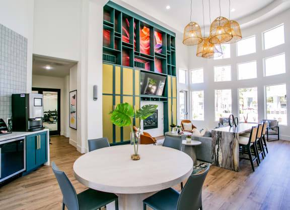 Octave Apartments clubhouse table and living room at Octave Apartments, Las Vegas, NV, 89123