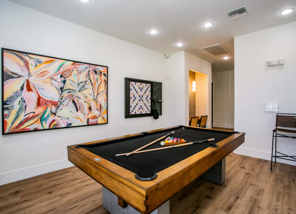 Octave Apartments  a game room with a pool table and a painting on the wall at Octave Apartments, Nevada