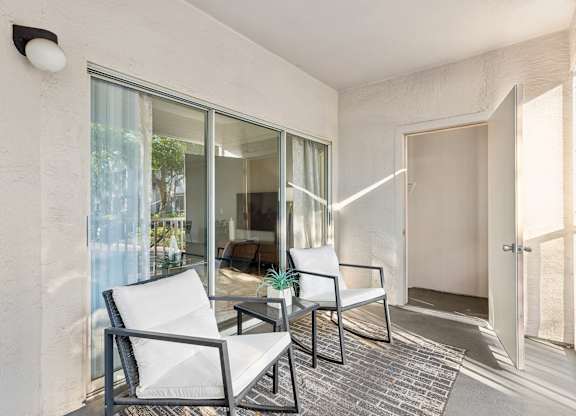 Two chairs are placed on a patio.