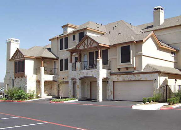 A large house with a garage and a driveway.