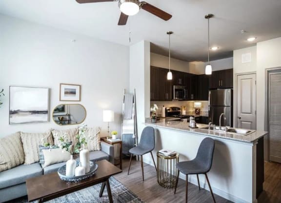 Living room with attached kitchen area  at Emerson at Buda, Buda, TX