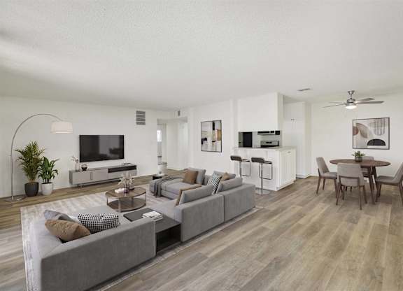 Open concept living and dining area with wood style flooring at Parc @ 5 Apartments, Downey