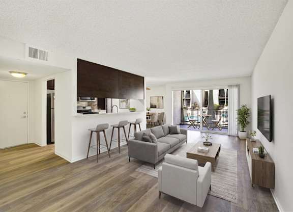 Open living space with breakfast bar and balcony access at Parc @ 5 Apartments, Downey, 90240