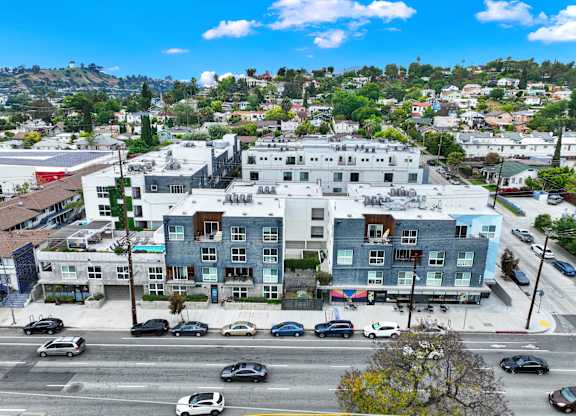 an aerial view of a city with a mountain in the background at the perch, Los Angeles California