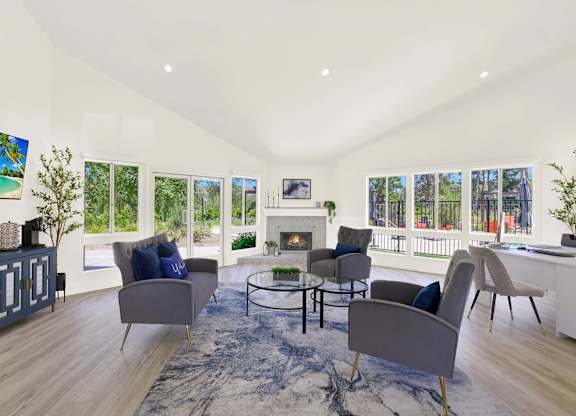 a living room with couches and chairs and a fireplace at Monterra Ridge Apartments, Canyon Country