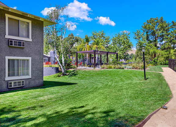 a yard with a house and a gazebo at Monterra Ridge Apartments, California,91351