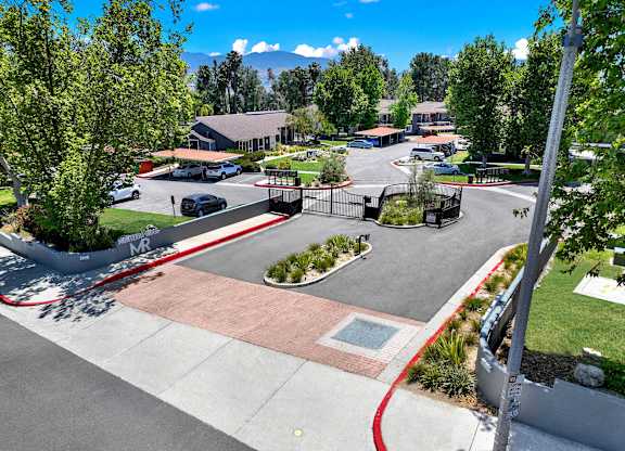 a view of a park with a playground and a parking lot at Monterra Ridge Apartments, California,91351
