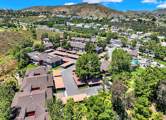 a aerial view of a neighborhood with houses and trees at Monterra Ridge Apartments, Canyon Country