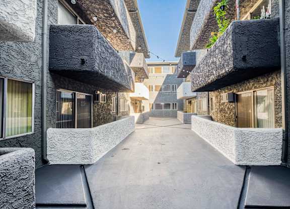 view of corridor between buildings