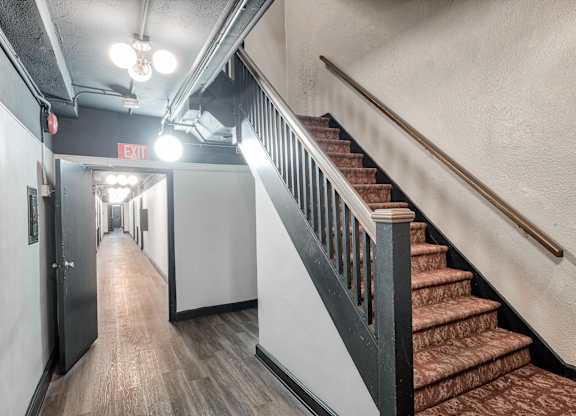 Staircase and open ceiling view