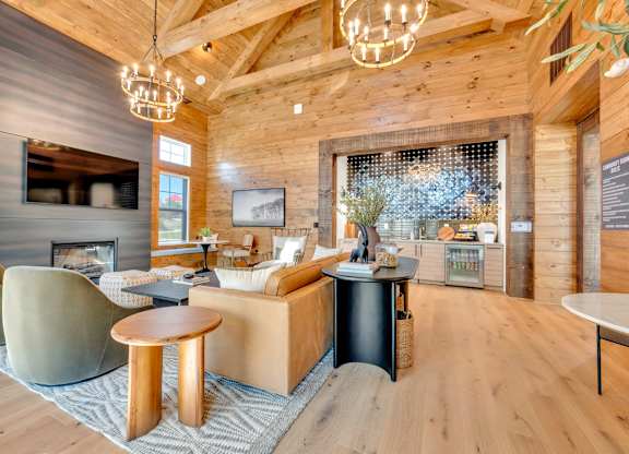 A modern living room with a fireplace and a large window.