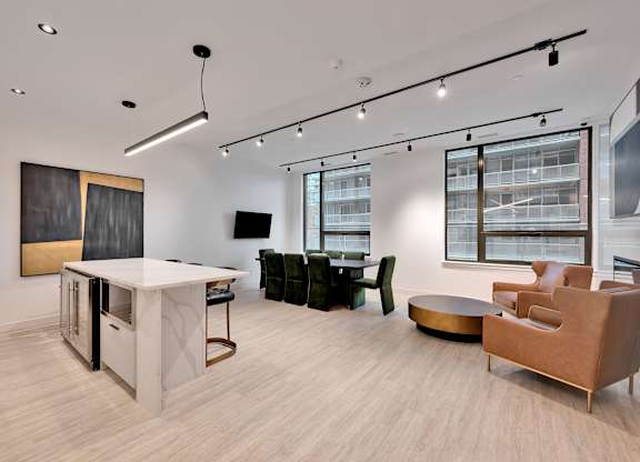 A modern living room with a white sofa and a wooden coffee table.