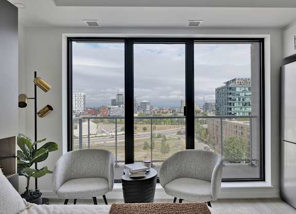 A modern living room with a view of the city.