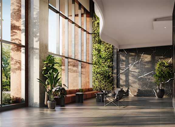 A modern living room with a large window and a green plant.