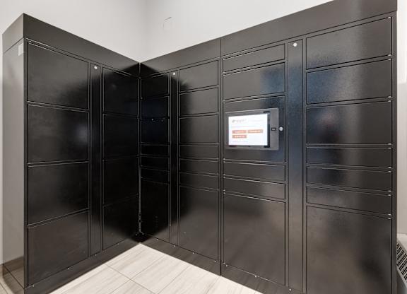A black metal locker room with a white door.