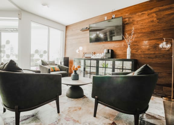 the coffee bar of a condo with glass doors and furniture at Canalside, Augusta, GA