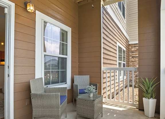 A patio with a table and chairs is shown.