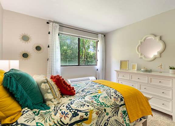 Expansive bedroom with room for a queen-size bed, additional furniture, and large closets.