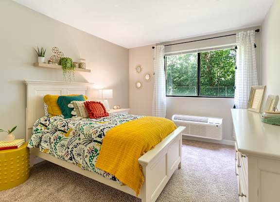 Expansive bedroom offering flexible furniture space and large closets.