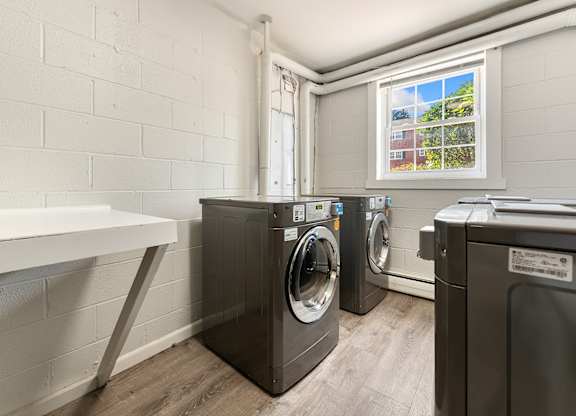 A laundry room with a washer and dryer.