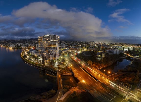 a night view of the city from the roof of a building