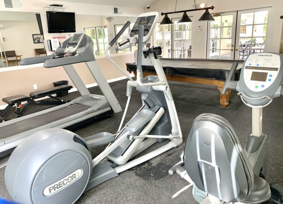 a gym with treadmills and other exercise equipment in a wellness center at Victoria Springs, Riverside, 92504