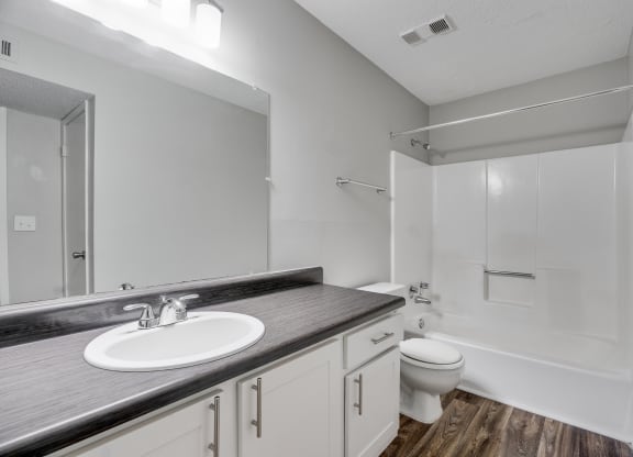 Bathroom With Wood-Style Flooring & Shower With Tub