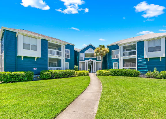 Lush Greenery & Grounds In Front Of Apartment Homes