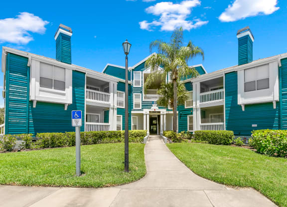 Exterior Entrance To Apartment Homes At Isles Of Gateway