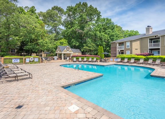 Spacious Pool Sundeck With Brick Pavers & Lounge Chairs