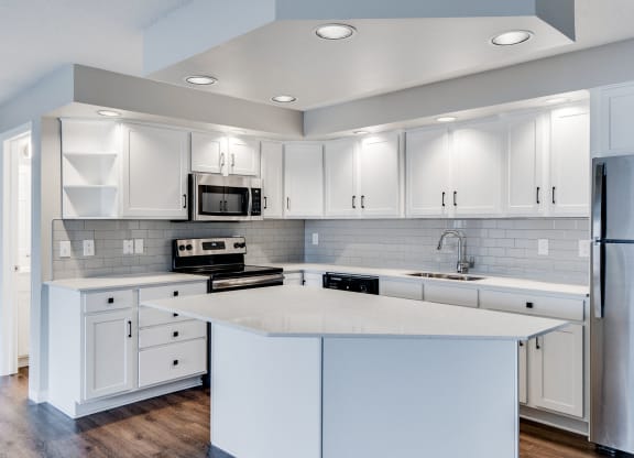 Large Kitchen with Recessed Lighting and Stainless Steel Appliances