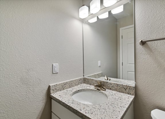 Bathroom With Granite Vanities