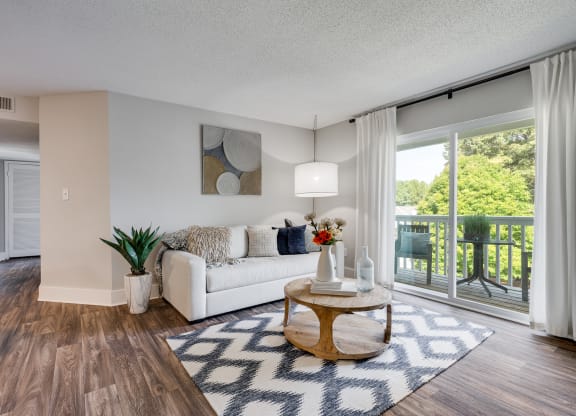 Living Room With Wood-Style Flooring, Light Grey Walls & White Trim
