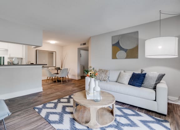 Open-Concept Kitchen, Dining, & Living Room With Wood-Style Flooring