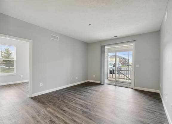 Spacious Living Area With Wood-Style Flooring