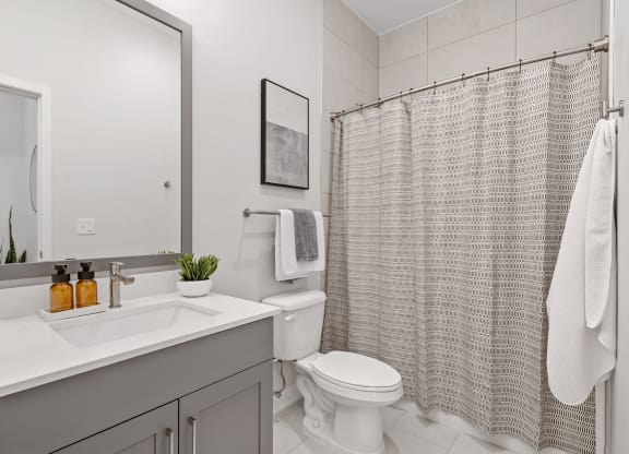 Bathroom Featuring Tiled Floor & Shower