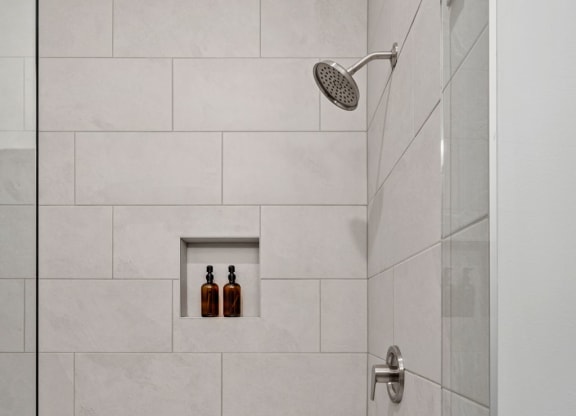 Tiled Shower Featuring Glass Door