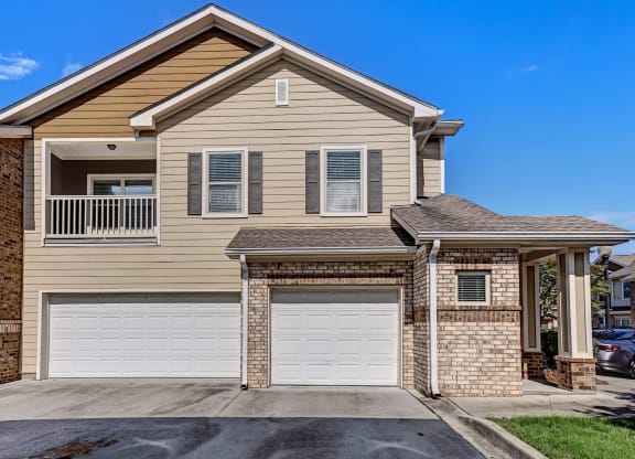 Exterior Of Apartment Home With Attached Garage