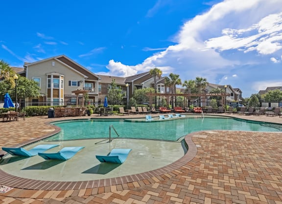 Zero-Entry Pool With Sun Lounger Chairs