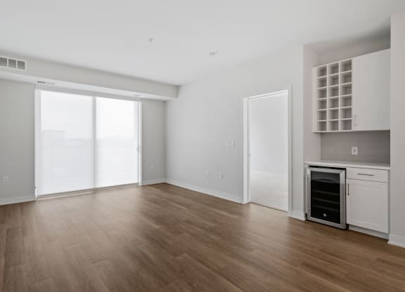 Spacious Living Area With Wood-Style Flooring